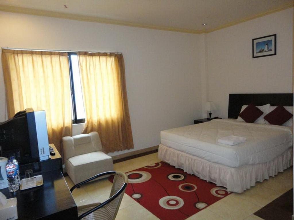 Grand Duta Hotel Palu Pokoj fotografie